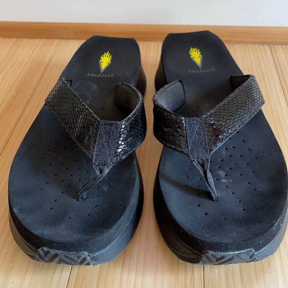 Volatile black flip flops